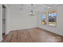 Dining room featuring a decorative ceiling, wood floors, and large windows at 277 Supernova Dr, York, SC 29745