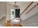 Bright foyer features a hardwood floor, staircase, and updated lighting fixture at 3040 Sunshower Hts, York, SC 29745