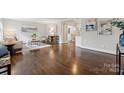 Inviting living room featuring hardwood floors, stylish furniture, and a barn door leading to the kitchen at 3725 Dunwoody Dr, Charlotte, NC 28215