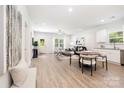 Spacious open-concept living area with dining space, plush seating, and bright natural light at 538 Williamson St, Charlotte, NC 28208