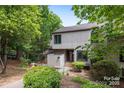 Charming townhome with neutral siding, a front patio, and mature landscaping at 58 Ridgeport Rd, Clover, SC 29710
