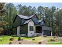Beautiful two-story home with a mix of brick and siding, complemented by a well-manicured lawn and landscape at 6265 Riviera Run Estates Dr, Hickory, NC 28601