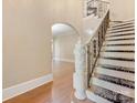 Detailed staircase with hardwood and carpeting leading to upper level at 703 Sainte Rose Ln, Charlotte, NC 28226