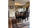 Inviting dining area with hardwood floors, a stylish rug, and contemporary furnishings at 715 N Church St # 613, Charlotte, NC 28202