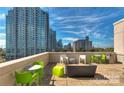 Modern outdoor patio area featuring contemporary furniture and city views at 715 N Church St # 613, Charlotte, NC 28202