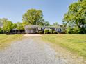 Charming single story home with a gravel driveway and carport at 7617 Pleasant Hill Church Rd, Marshville, NC 28103