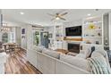Inviting living room features a fireplace with built-in shelves and a comfortable couch at 103 Claremont Way, Mooresville, NC 28117