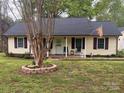 Cozy ranch-style house showcasing a well-manicured lawn, inviting front porch, and neat landscaping at 109 Wilson Acres Dr, Kings Mountain, NC 28086