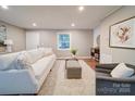 Cozy living room with neutral tones, plush seating, and ample natural light at 1159 Ragan Dr, Gastonia, NC 28054