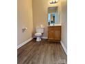 Functional bathroom featuring a classic vanity, toilet, and tile flooring for simple living at 117 24Th Nw St # 41, Hickory, NC 28601