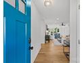 Bright entryway featuring hardwood floors and an open view into the stylishly furnished living spaces at 1330 Dean St, Charlotte, NC 28216