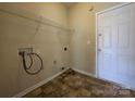 Functional laundry room with shelving and hookups, ready for your washer and dryer at 13409 Glasgow Green Ln, Charlotte, NC 28213