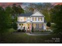 Charming two-story home with a well-manicured front yard and stone accents at 139 Autumn Grove Ln, Mooresville, NC 28115