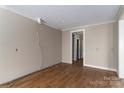 Spacious living room with hardwood floors and neutral wall colors at 2596 Polo Ln, Maiden, NC 28650