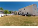 Spacious backyard featuring a patio area, new fence and lush lawn perfect for entertaining at 269 Keating Place Dr, Fort Mill, SC 29708