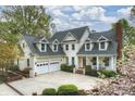 This inviting two-story home boasts an attached two-car garage and a cozy front porch at 272 Harbor Ridge Dr, Statesville, NC 28677