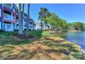 Condo with balcony overlooking waterfront views and well maintained community landscaping at 368 Northwest Dr, Davidson, NC 28036