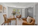 Bright home office with ample natural light, stylish furnishings, and a calming, neutral color scheme at 4056 Zilker Park Dr, Charlotte, NC 28217
