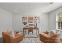 Serene home office featuring neutral tones, comfortable seating, and a well-lit workspace at 4056 Zilker Park Dr, Charlotte, NC 28217