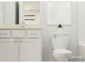Modern bathroom features white cabinets, marble countertop, and sleek fixtures at 4116 Skyboat Cir, Fort Mill, SC 29715