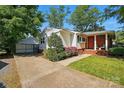 This home includes a driveway, manicured lawn and brick accents at 576 Scaleybark Rd, Charlotte, NC 28209