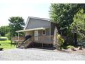 Charming house featuring a wooden deck and stairs, perfect for enjoying outdoor living at 5769 Birch St, Conover, NC 28613