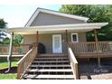Image showing the porch, featuring wooden stairs, railings, and a covered entrance to the home at 5769 Birch St, Conover, NC 28613