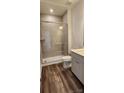 Modern bathroom with glass shower, sleek toilet and gray vanity at 642 Amberjack Pl # 75, York, SC 29745