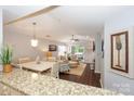 Open concept living room with lots of natural light, hardwood floors, and cozy furnishings at 765 Southwest Dr, Davidson, NC 28036