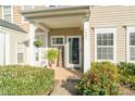 Inviting front porch with a welcome sign and lush plants at 1097 Constitution Park Blvd, Rock Hill, SC 29732