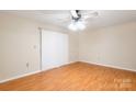 This bedroom has a ceiling fan, closet and sliding glass doors to access the balcony at 1773 Hunters Trl, Rock Hill, SC 29732