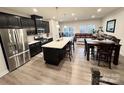 Open kitchen flows into the dining and living areas, perfect for entertaining and Gathering gatherings at 2315 Doby Creek Ln # 77, Charlotte, NC 28262