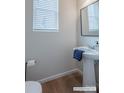 Stylish half-bathroom features pedestal sink, modern fixtures, and tasteful decor at 2555 Ruby Dixon Crossing Dr # 16, Gastonia, NC 28056