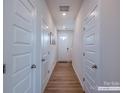 Inviting entryway features wood-look flooring, neutral walls, and modern lighting fixtures at 2555 Ruby Dixon Crossing Dr # 16, Gastonia, NC 28056