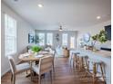 Open-concept living space includes dining area and breakfast bar with modern finishes and ample natural light at 2555 Ruby Dixon Crossing Dr # 16, Gastonia, NC 28056
