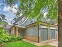 Charming exterior displaying a two-car garage, shingle siding and manicured lawn at 2616 Colton Dr, Charlotte, NC 28211