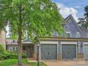 Charming home featuring a two-car garage, and shingle siding, set in a lush, landscaped neighborhood at 2616 Colton Dr, Charlotte, NC 28211