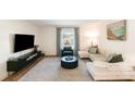 Bright living room with modern furnishings, large window, and stylish decor at 2630 Park Rd # H, Charlotte, NC 28209