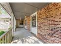 Covered porch with brick columns and railing, offering a welcoming entrance at 2643 Providence Dr, Gastonia, NC 28052