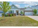 Inviting home exterior features a well-manicured lawn and appealing landscaping at 2890 Westshore Pl, Denver, NC 28037