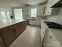 Spacious kitchen featuring granite countertops, modern appliances, and a stylish island at 3214 Mcharney Dr # 34, Harrisburg, NC 28075