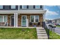 Charming front porch with stone accents, seating, and well-maintained lawn at 3722 Windy Pine Nw Ln, Hickory, NC 28601