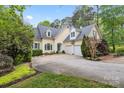 Inviting two-story home with a three-car garage, lush landscaping, and a well-maintained lawn at 4525 Island Waters Dr, Denver, NC 28037