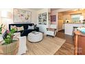 Stylish living room with hardwood floors, designer furniture, and a cozy, inviting atmosphere at 557 Wakefield Dr # A, Charlotte, NC 28209