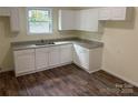 Updated kitchen featuring new cabinets and granite countertops at 59 Pine St, Great Falls, SC 29055