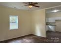 Bright living room with hardwood floors and a ceiling fan at 59 Pine St, Great Falls, SC 29055
