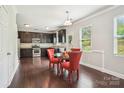 Eat-in kitchen featuring dark wood floors, stainless appliances, and a bright window at 620 Millstream Dr, Rock Hill, SC 29732