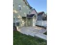 Picture of a concrete patio area and fenced backyard of a house, offering a private outdoor space at 6707 Dunton St, Huntersville, NC 28078