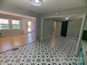 Open floorplan with hardwood floors and striking black and white tile, blending modern design with classic appeal at 805 Mark Dr, Shelby, NC 28152
