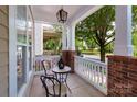 Cozy front porch with charming table and chairs, perfect for relaxing outdoors at 10102 Tolleson Ave, Charlotte, NC 28277